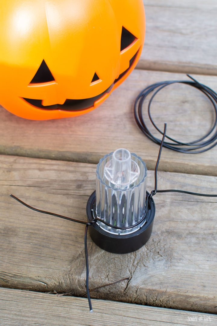 DIY Halloween Lights made with Pumpkin Trick or Treat Pails by Scratch and Stitch