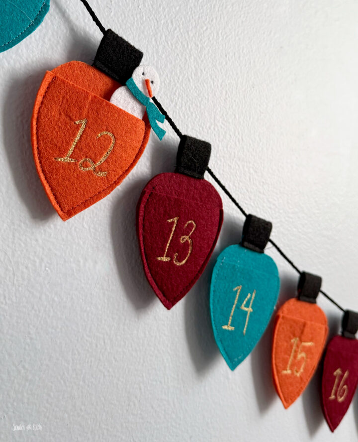 Felt Christmas Lights Garland Advent Calendar with Text by Scratch and Stitch