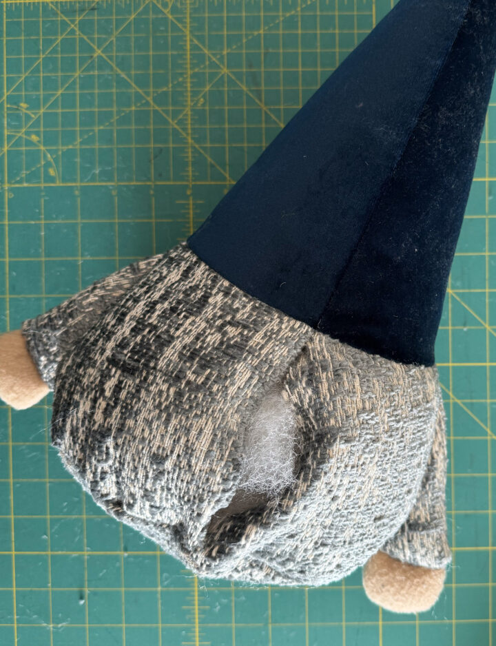 stuffing the plush gnome with poly-fil stuffing