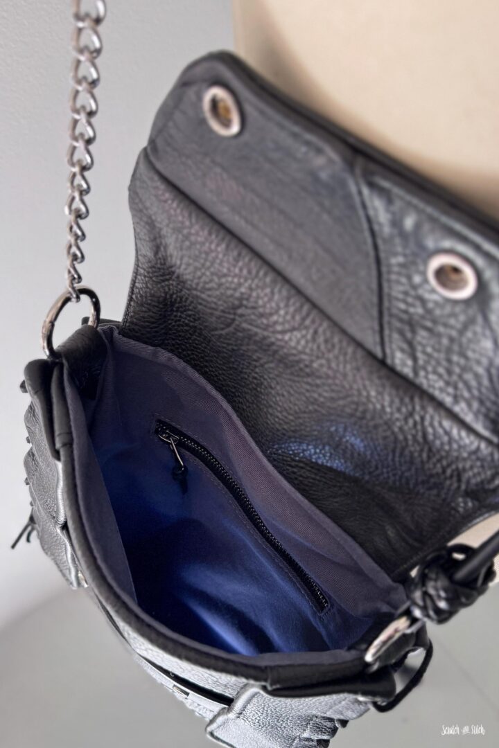 Custom leather memory bag with shirt lining, slip pocket, and zipper pocket inside