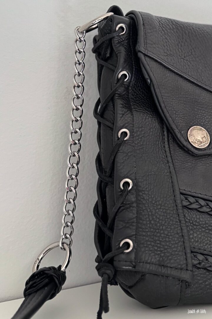 Chain strap detail on a handmade memory bag made from a leather biker vest